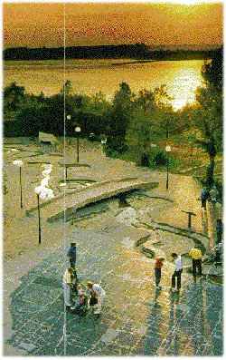 Riverwalk with folks examining the map of Memphis