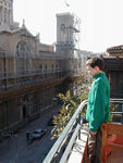 Tote watching construction from the balcony with cathedral in the background