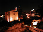 The Forum at night.  The big brick building is the Curia, where the Senate met.  Three hundred senators met here.  The ceiling is very high, apparently a substitute for a microphone.