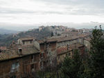 View from stairs between Piazza Rossi Scotti and Via Bartolo.  You can see a city wall running up the middle of the photo.  On the 
