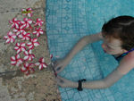 Playing with flowers at the pool.