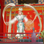 This is a lady waving long scarves around in interesting patterns.  She may have turned up something to do with the monkey god story, but we're not sure.  Her scarf waving was cool anyway.