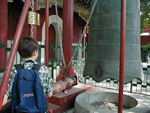 Tote pretending to ring a big bell at the Lama Temple.  Amazingly, one must pay for the privilege, which is why Tote is only pretending.
