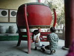 A drum with drum stele in the background.  The drum stele are essentially peculiar stone tablets recording one thing or another.