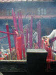 Pilgrims and incense at Golden Summit Temple