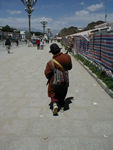 Man with a triple-decker prayer wheel