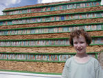 Maggie with 1000 buddhas at the bottom of Changpo Ri.  Changpo Ri is a hill in the middle of Lhasa with lots of devotional things and a steel telecom tower on it.