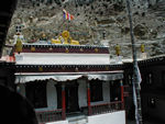 Front of the temple building with the dharma wheel and deer symbol that represents Buddha preaching to the animals