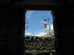 Prayer flags through doorway