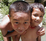 Kids swimming at the waterfall