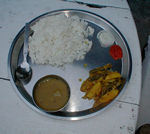 Dhal Bhat, rice and lentil soup and vegetables and a little pickle and hot sauce.  The list of components is the same all over, but the taste varies widely.  This is the regular Nepali dinner.  It is customary for the cook to offer more of everything, so it's a wonderful thing to order while hiking.  Since it's the offseason, we often had to wait an hour or so before the food was ready, but that was a nice (and usually interesting) way to rest in the middle of the day.