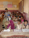 Maggie and Ragab in the El Koom school.  We all like Ragab, one of the workers in the hotel, but Maggie and Ragab spent hours goofing around with each other.