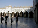 Courtyard in the Mosque.  The first mosques were modeled on the place of worship of the Prophet Muhammad--the courtyard of his house at Medina, and the basic structure remains the same.